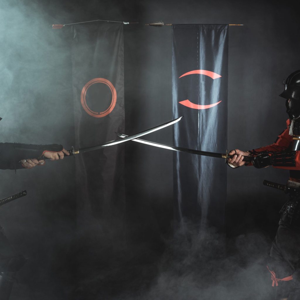 samurai warriors crossing katana swords in front of clan symbols